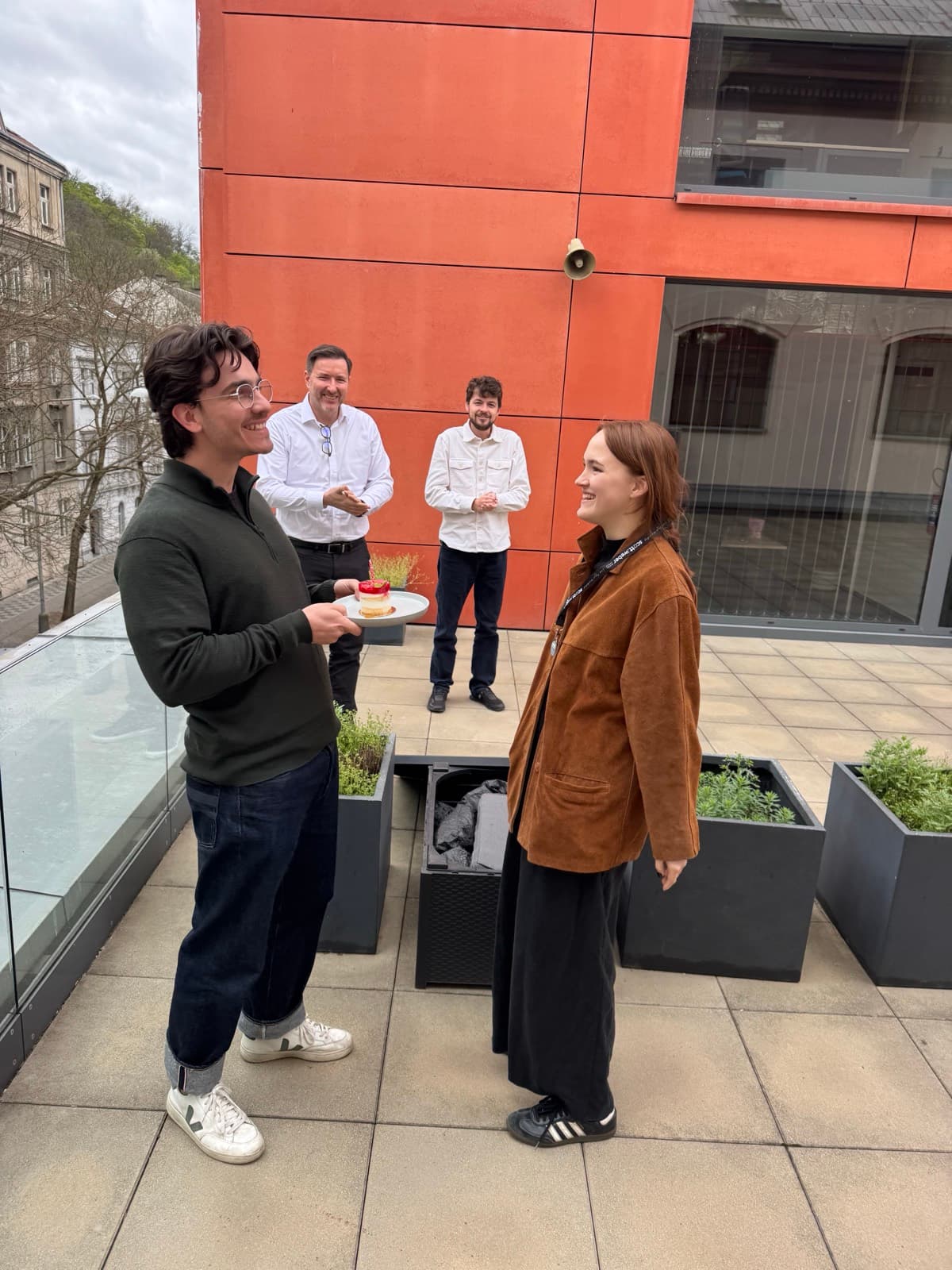 A celebration with cake on the office terrace