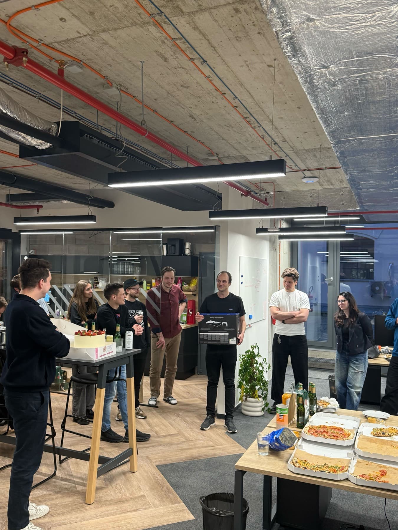 The team celebrating a milestone in the office